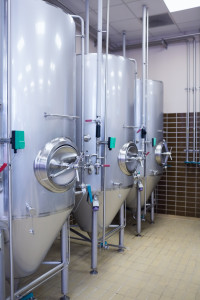 lose up of a steel container to make beer in the factory